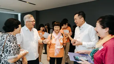 Hosts networking with guests at Senior Active Force Framework launch event at National Design Centre Singapore.