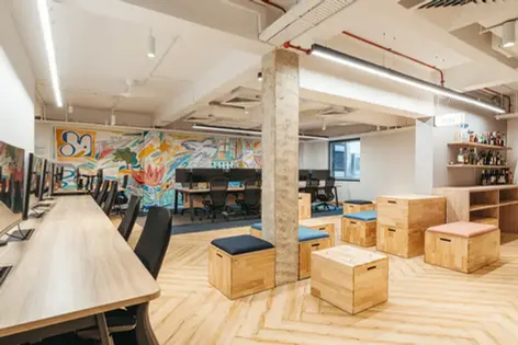 Collaborative workspace showcasing unique crate seating and vibrant interiors.