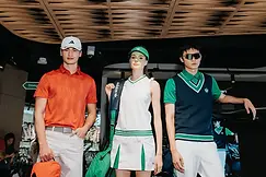 Three models wearing Adidas golf apparel in a store for corporate event photography