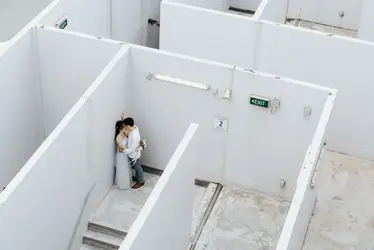 Bride and groom exploring an architectural location near Marina Square during Singapore pre-wedding photoshoot.