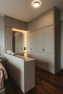 Custom vanity with integrated storage and elegant stone countertop.