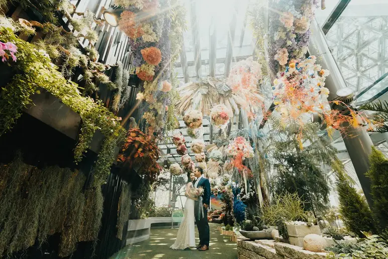Bride and groom embracing during their wedding celebration at Gardens by the Bay Floral Fantasy Singapore