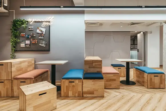 Colourful crate seating creating a playful collaborative workspace.