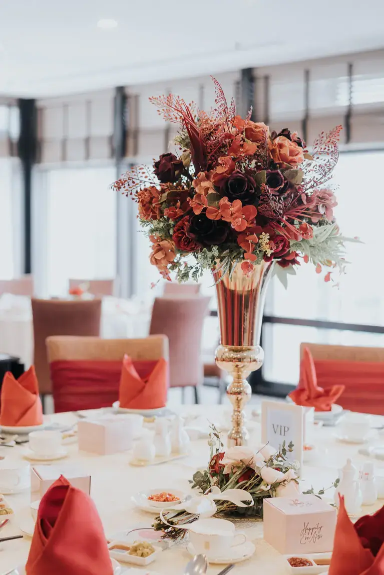 Reception tables and wedding decorations arranged at [Venue Name].