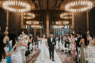 Bride and groom wedding march-in at Andaz Singapore during wedding celebration.