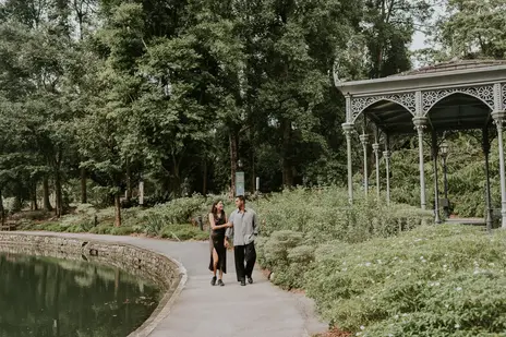 Romantic proposal at Singapore Botanic Gardens surrounded by lush greenery at the pavilion beside swing me mama sculpture.