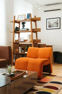 Bright breakout area with soft seating and vibrant interior finishes.