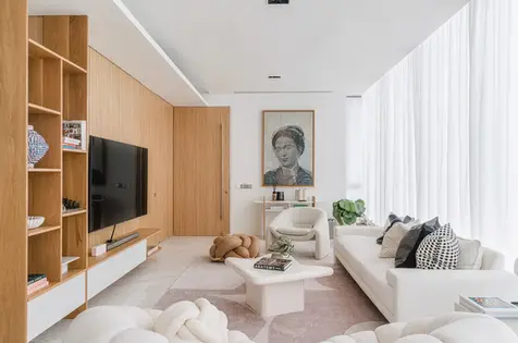 Living room with custom built-in cabinetry and subtle wood accents throughout.