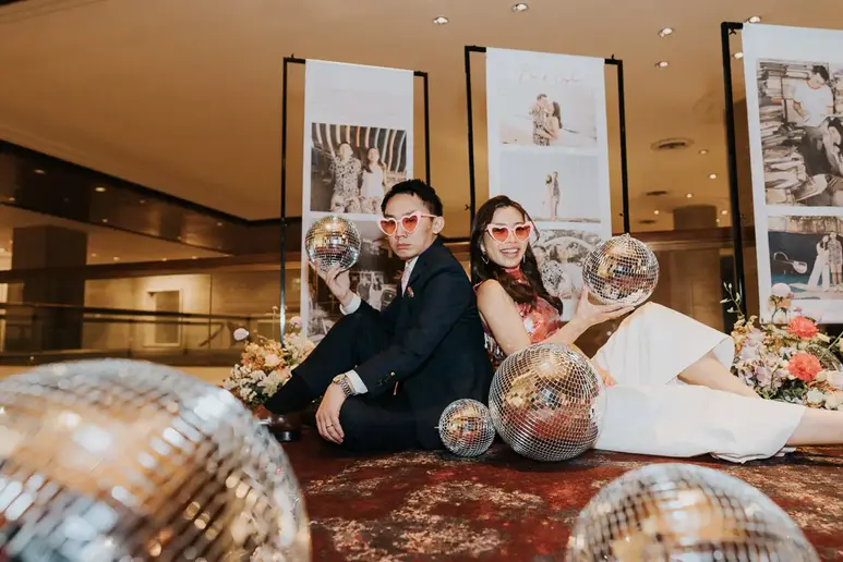 Bride and groom seated together for wedding portraits at Sheraton Towers Singapore