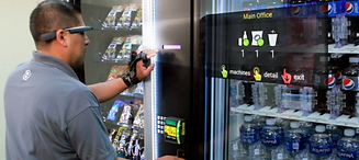 GVRC technician working on a vending machine.