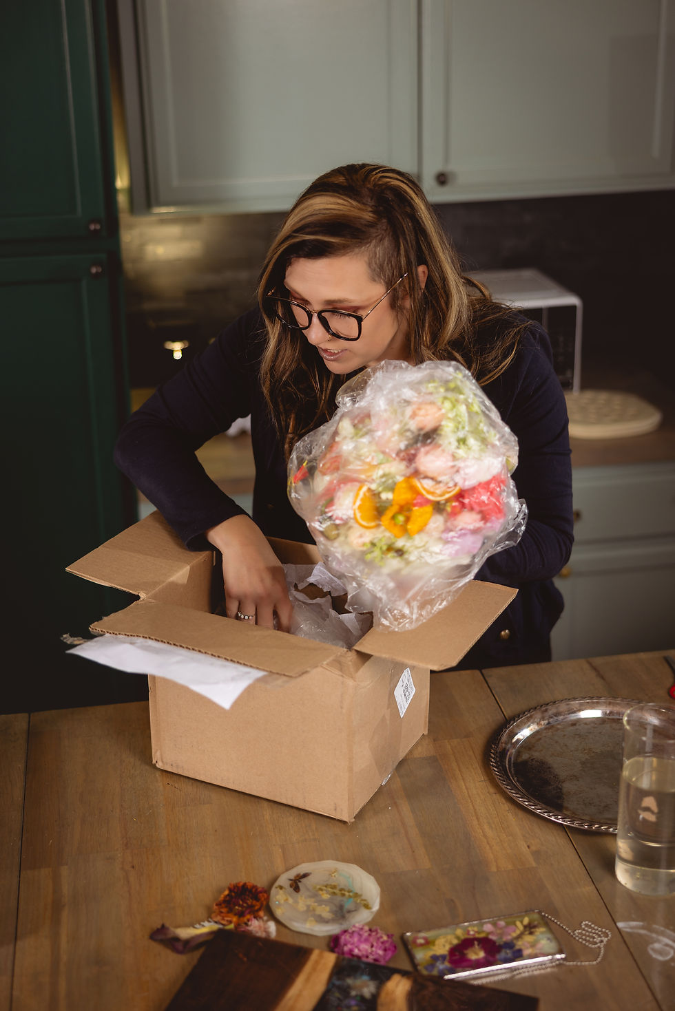Kelly Bride, The Bride's Floral Mortician, opening a received Bouquet for Preservation
