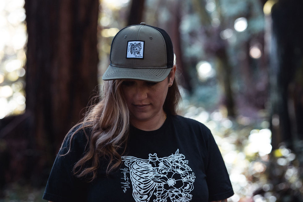 Green Trucker Cap with Memento Mori Patch and Memento T-shirt from The Bride's Floral Mortician