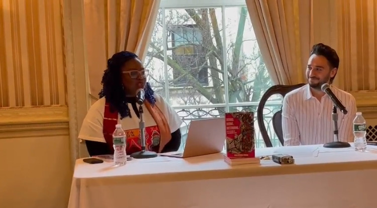 Rita speaking during an international discussion