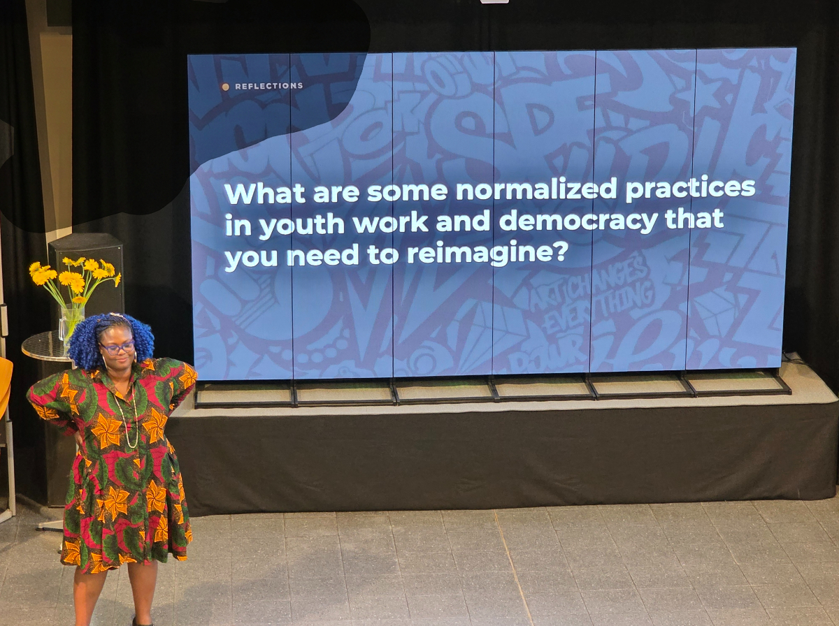 Rita presenting a question about youth work and democracy