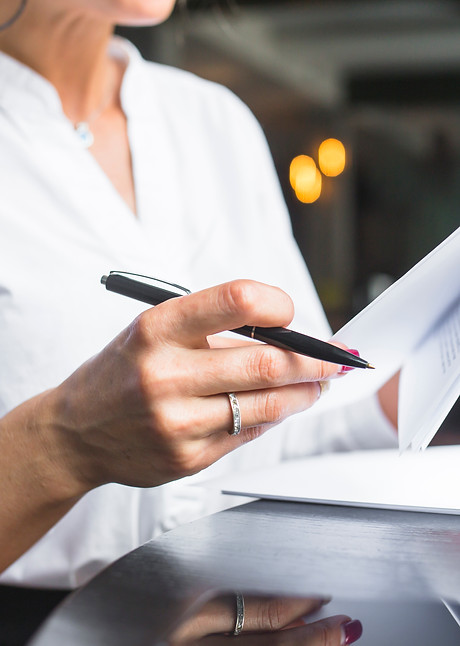 close-up-of-woman-examining-document.jpg