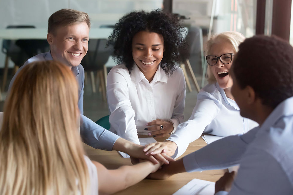 Happymultiethnicemployeesstackinghandsengagedinteambuilding.jpg
