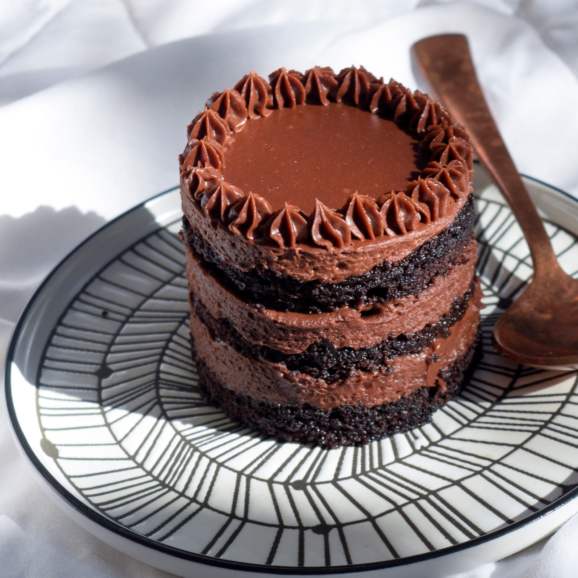 Chocolate and hazelnut praline cake with layers of cocoa sponge and dark chocolate ganache