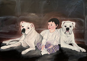 A baby girl with two white dogs