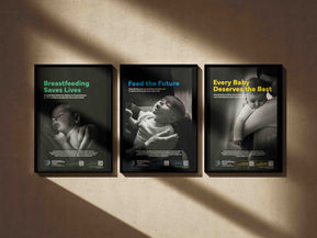 Three posters of babies with colored text hanging on a wall