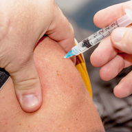 man getting flu shot