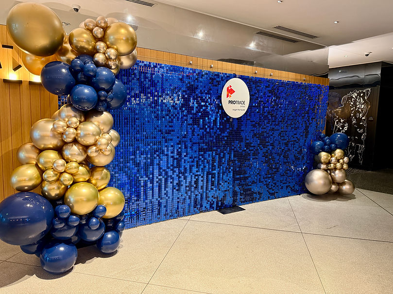 PTU 2026 corporate event W Brisbane_XL blue shimmer wall with balloons and signage.JPG