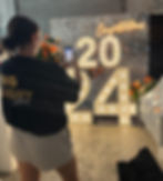 Make sure those pics are on point! Hiring event letters is a fantastic way to incorporate extra light to your event (and they look AMAZING in photos). Pictured: Silver shimmer wall & sunset orange faux florals.