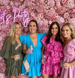 Bella pink flower wall with 'Let's Party' neon sign at Blackbird Brisbane