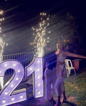 21 light up numbers set to pastel purple for a backyard birthday party