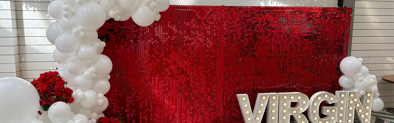 Red shimmer wall and VIRGIN 60cm light up letters