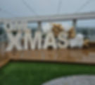Rooftop Christmas party for QML with our two-tier light up letters and gold and white balloon garland.