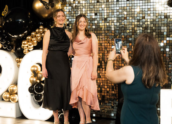 Milestone corporate party '20' 1.2m light up numbers with 60cm light up letters 'PJ'. Featuring a shimmer wall with balloon garland.