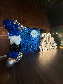 20 YEARS corporate milestone with shimmer wall balloons and acrylic disk.JPG