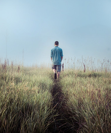 Man Walking in Fields