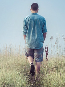 Man Walking in Fields