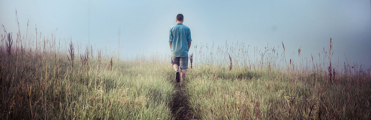 Man Walking in Fields