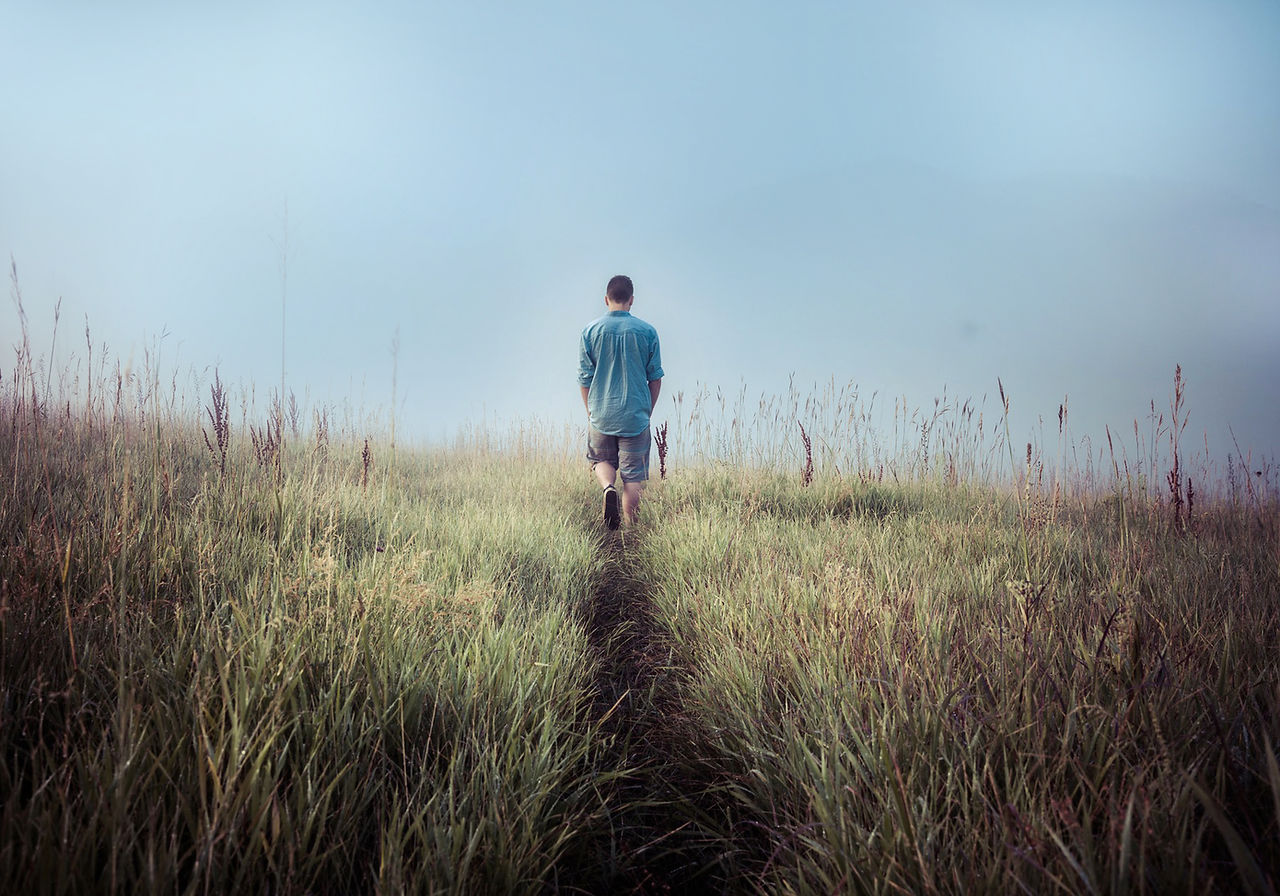 Man Walking in Fields