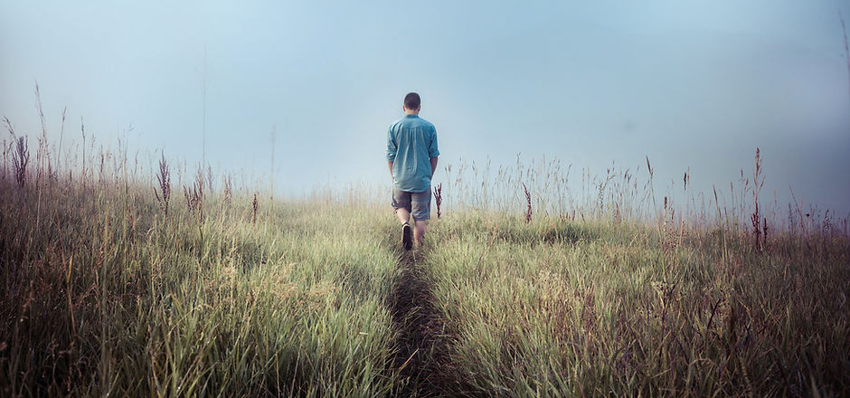Man Walking in Fields