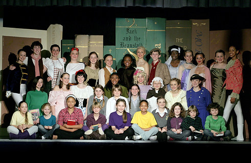 Young students onstage after a show