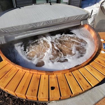 Crafted from clear red western red cedar hot tub by J D Woodworking