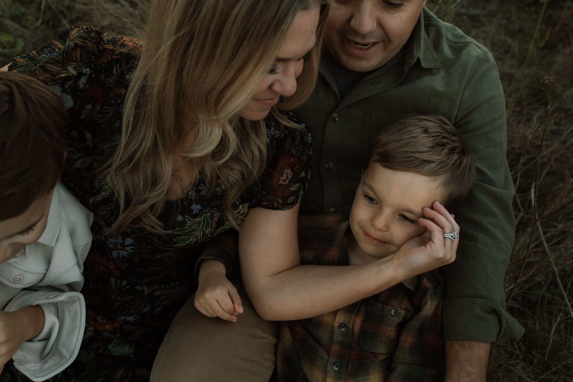 a mom loves on her son during a photography session by Nicole Fitzwater