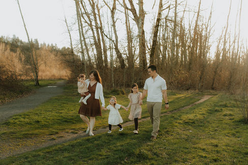 family walks on trail at sandy river delta park in troutdale oregon