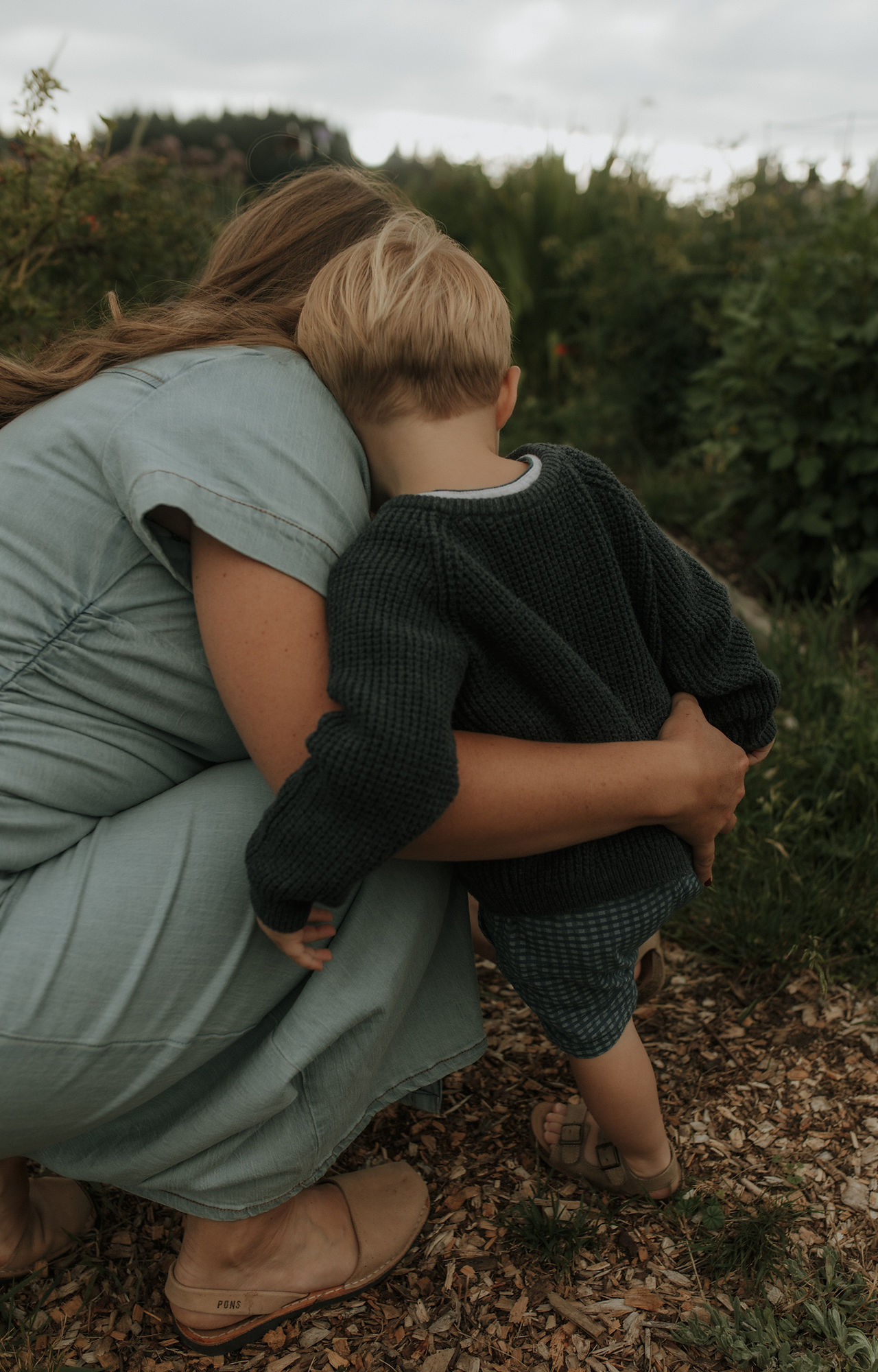 son hugs mom