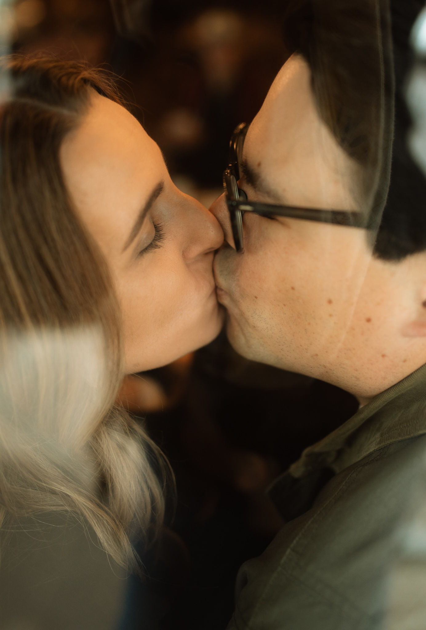 mom and dad kiss through portland coffee shop window