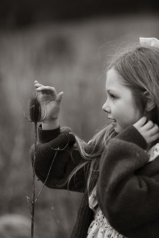 girl touches flower in the Columbia river gorge