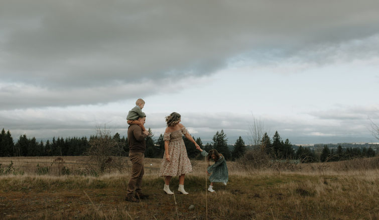 family dances on hillside in portland oregon photo session