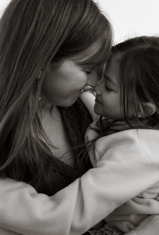 mom and daughter bump noses during a portland family photographer session