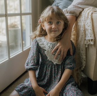 girl gives silly look during a family photographer session in her portland home
