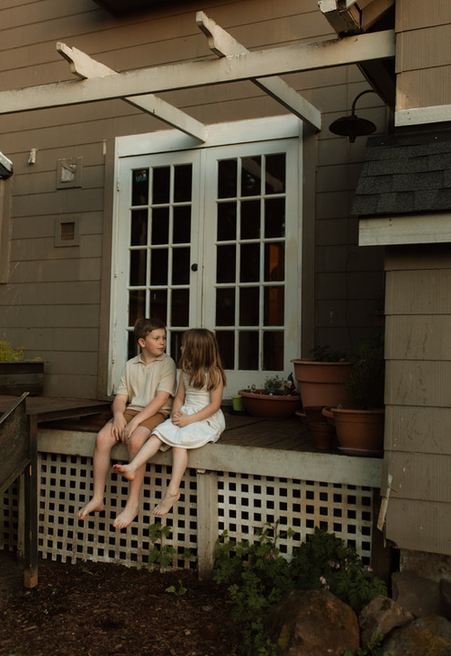 children sit on deck