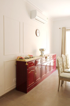dining area, red console, luxury interiors, luxury dining room, framed wall