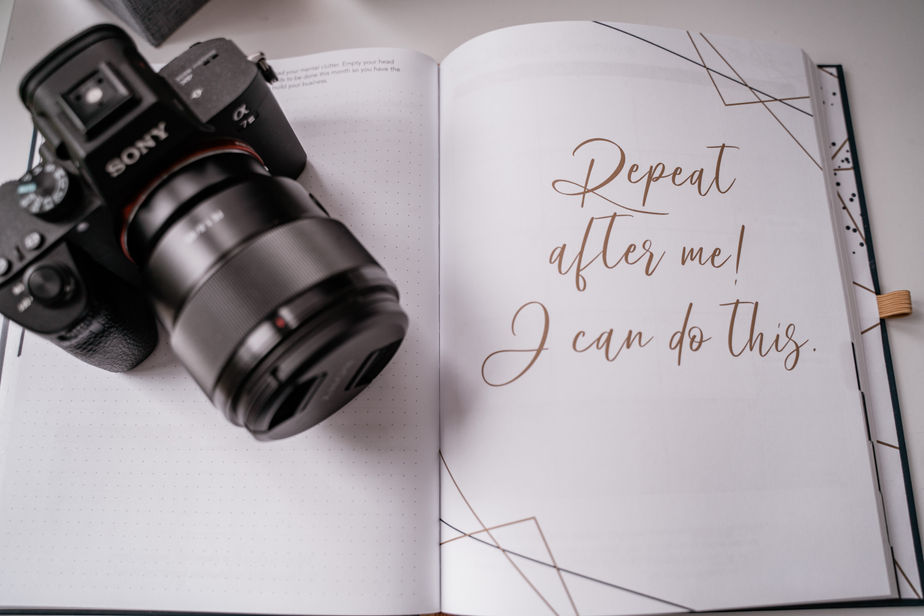 affirmation saying "Repeat after me! I can do this" with camera resting on book
